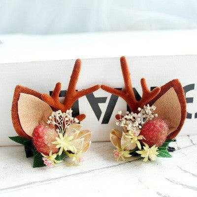 Children's Christmas hair clip with fabric antlers and floral decoration