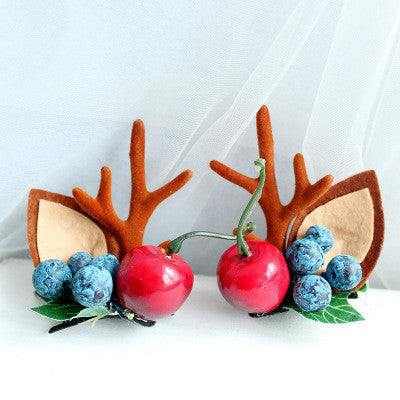 Children's Christmas hair clip with fabric antlers, cherries, and blue berries design