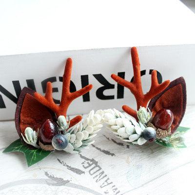 Children's Christmas hair clip with fabric antlers and decorative berries