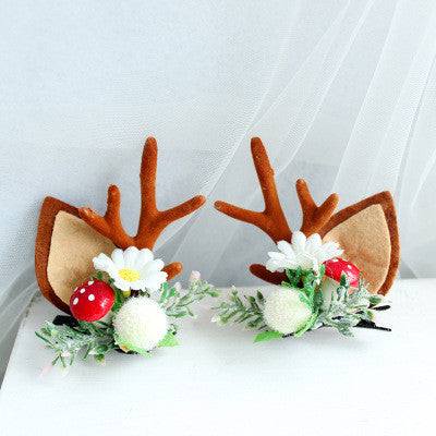 Children's Christmas hair clip with fabric antlers, flowers, and festive decorations