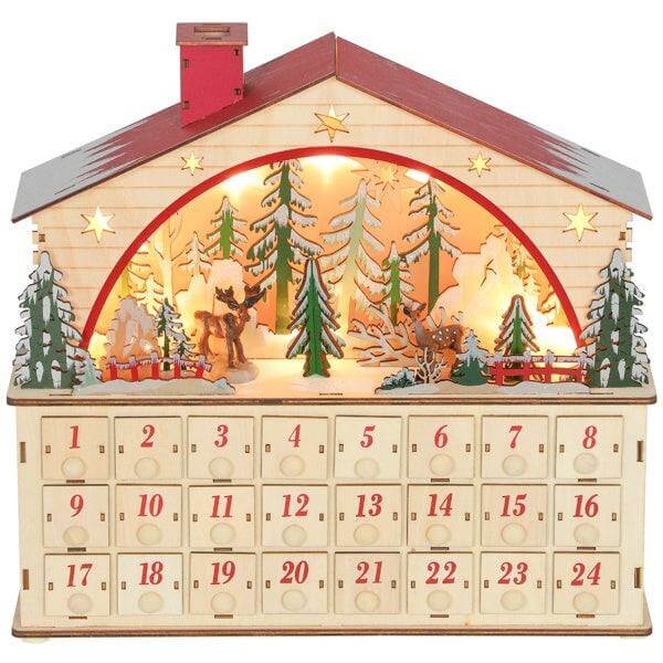 Christmas advent calendar in house shape with 24 numbered drawers and warm LED lights displaying a festive village scene