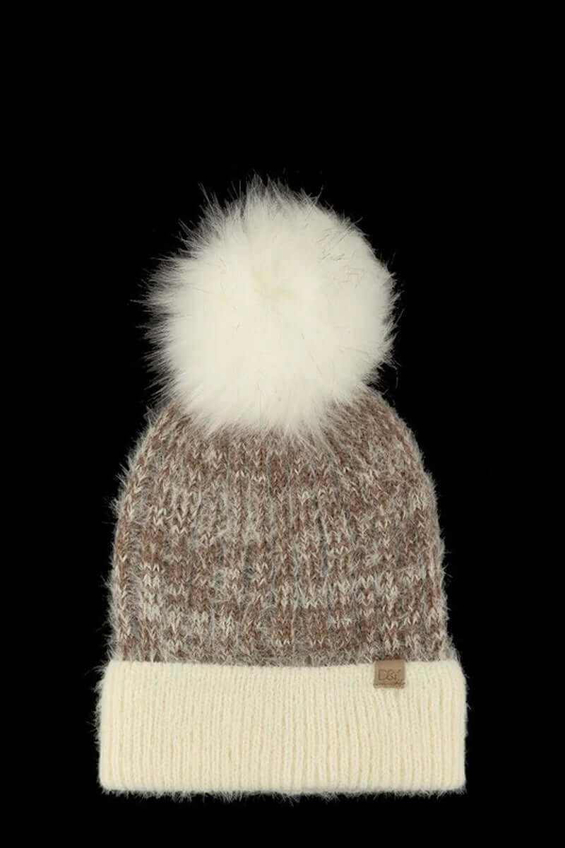 Chunky knit faux fur pom beanie in brown and cream, perfect for winter style and warmth.