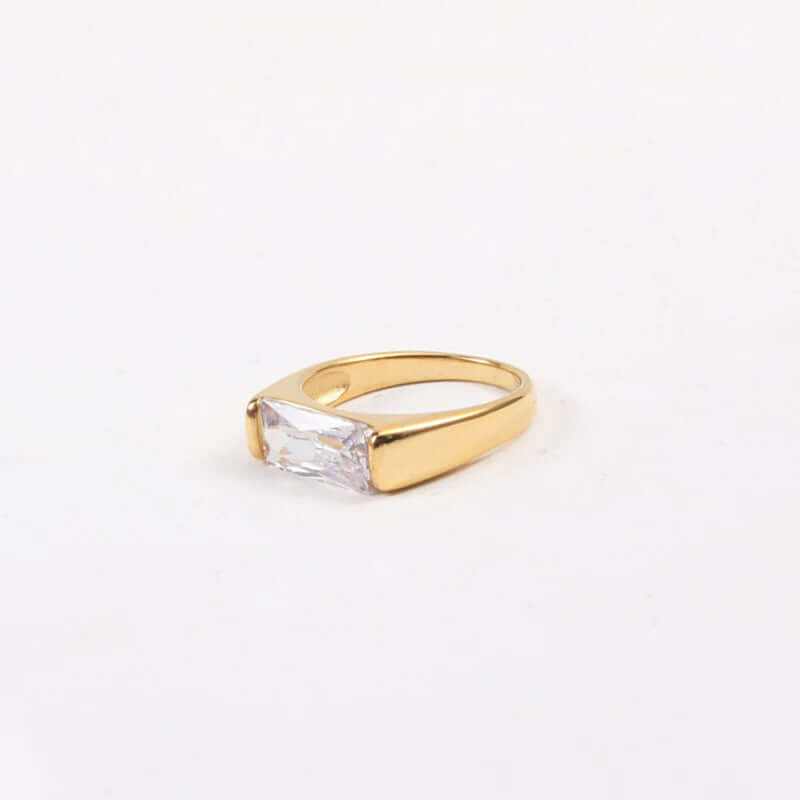 Elegant 18K gold plated ring featuring a rectangular stone, perfect for adding a touch of sophistication to any outfit.