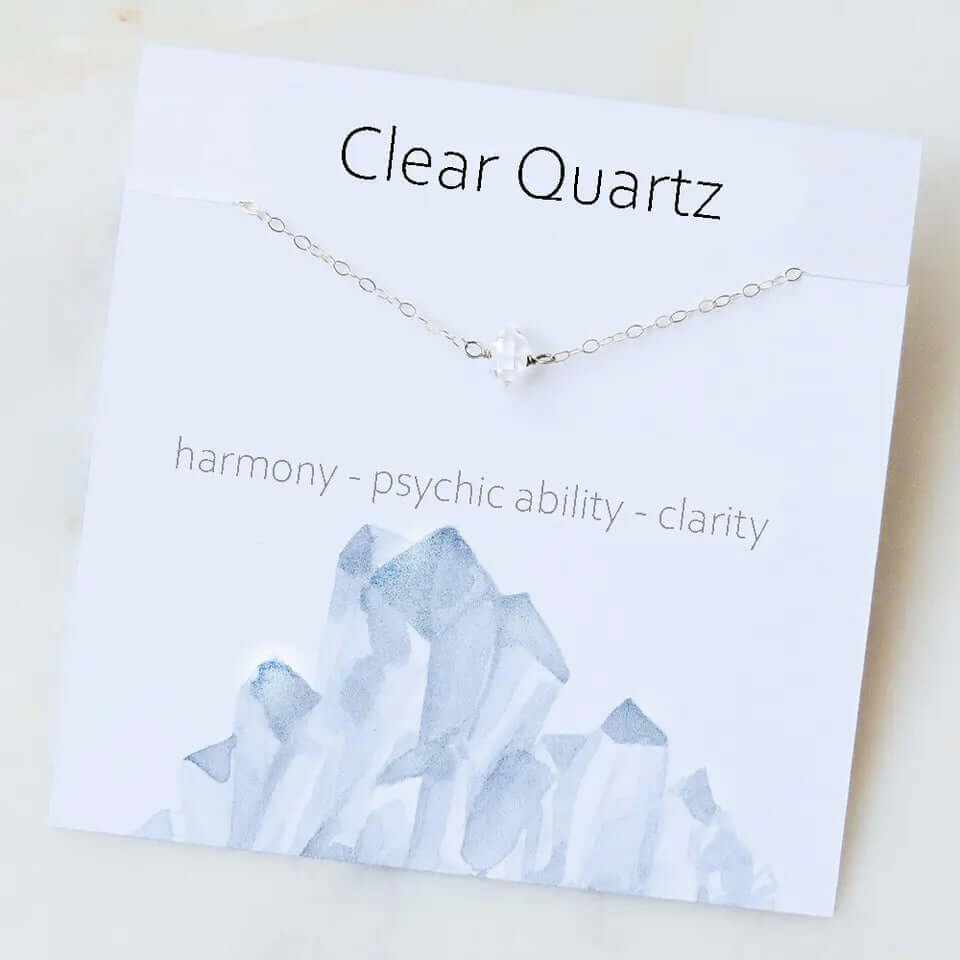 Clear quartz necklace on display card, symbolizing harmony, psychic ability, and clarity.