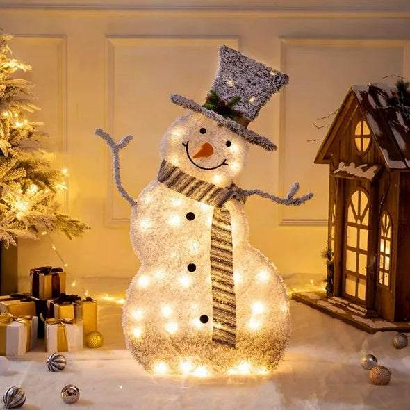 collapsible LED Christmas snowman decoration with warm white lights and festive scarf in cozy indoor setting