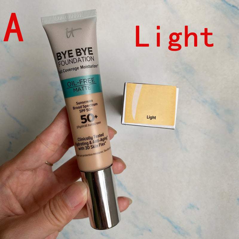 Matte oil-free liquid foundation tube with SPF 50+ in light shade held by hand next to light color card
