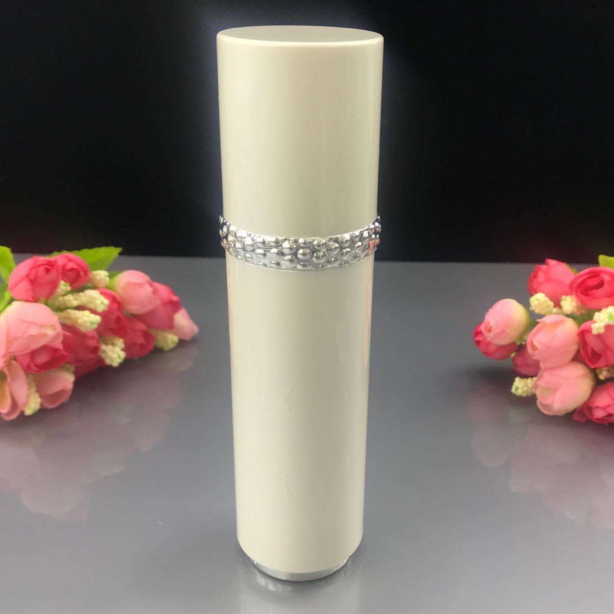 Elegant white cosmetic bottle with rhinestone band from High-grade Sub-bottling Pearl Set, ideal for creams and lotions.