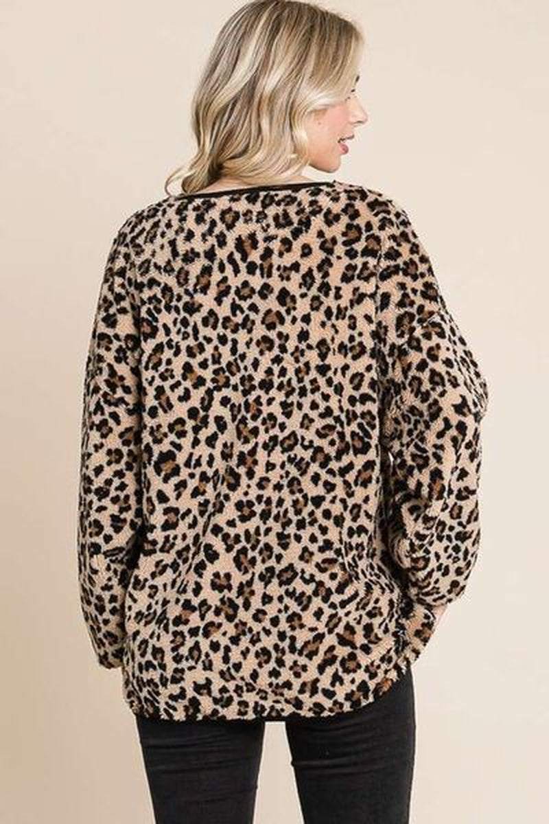 Back view of cozy leopard faux fur round neck top, showcasing its stylish print and relaxed fit.
