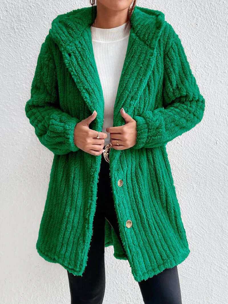 Cozy teddy hooded winter coat in vibrant green, showcasing soft fleece texture and relaxed fit.