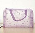 Transparent travel floral waterproof cosmetics bag with purple handles and floral pattern