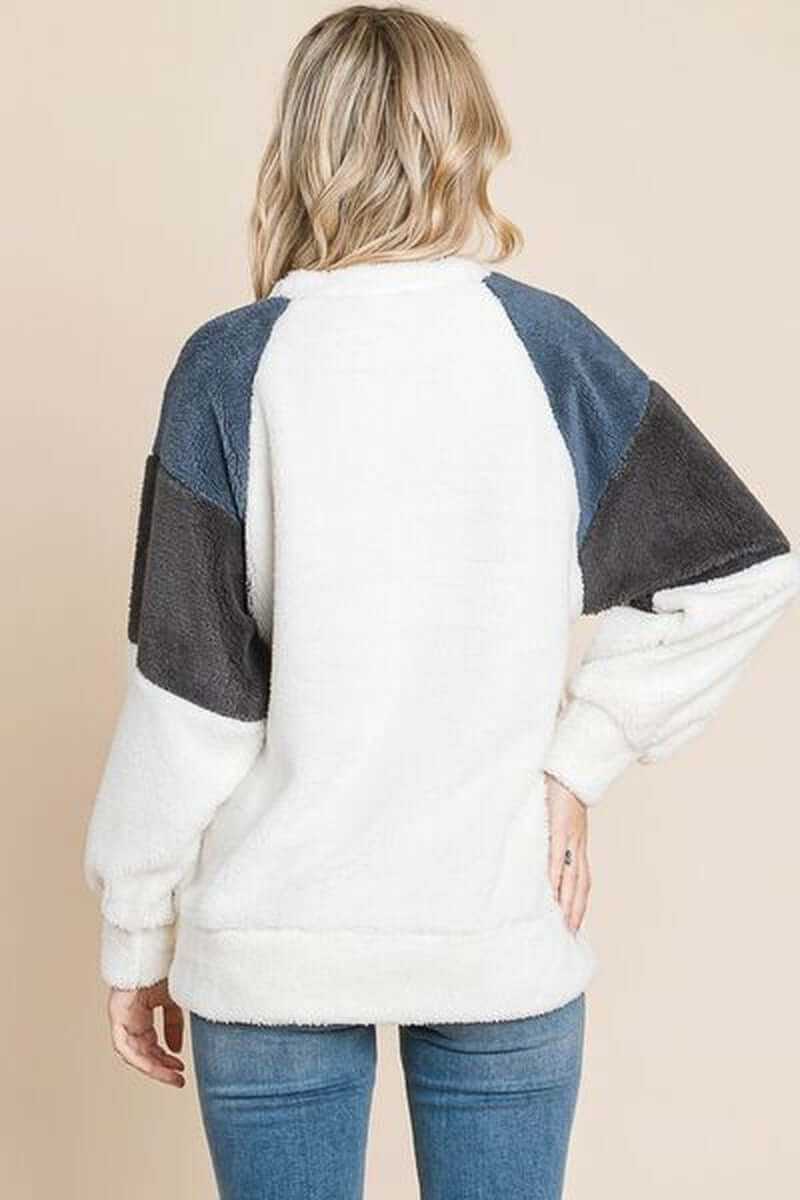 Back view of a Color Block Faux Fur Raglan Sleeve Sweatshirt in white, gray, and blue for a trendy winter look.