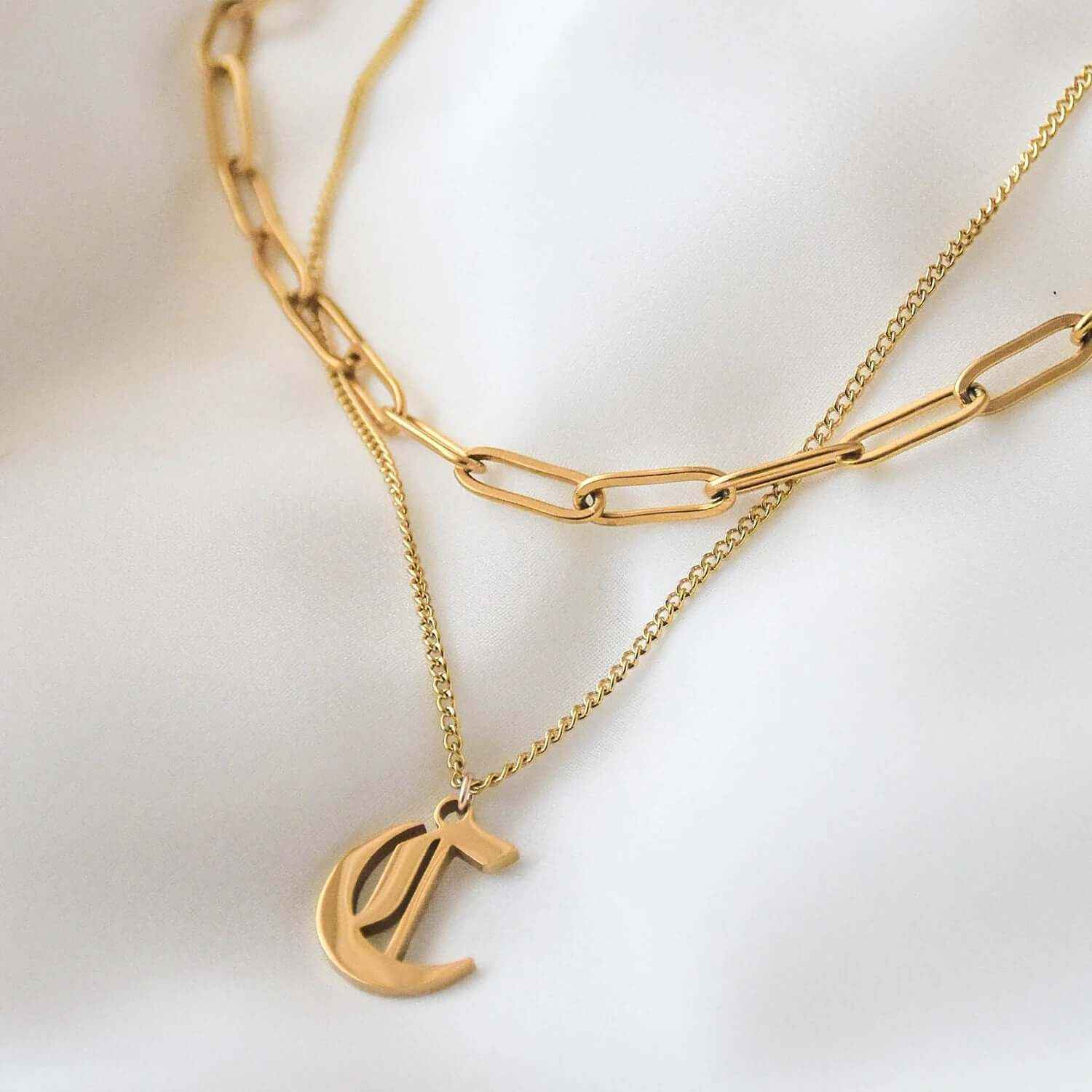 Custom Gothic initial necklace with gold plated 'C' pendant on a delicate chain.