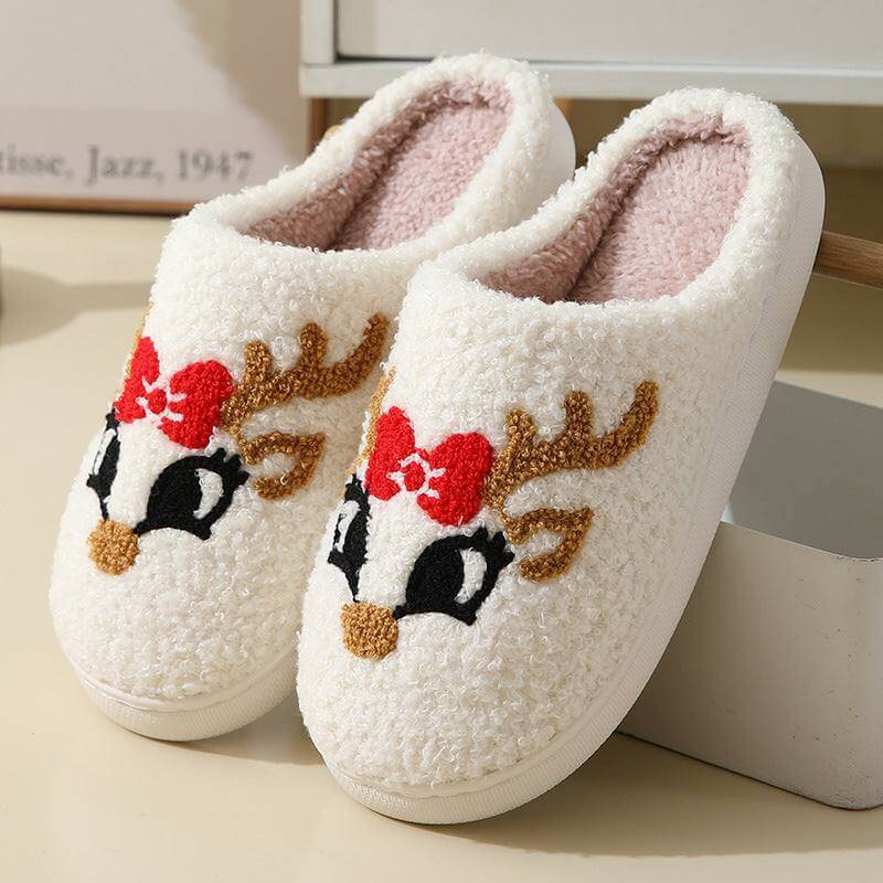 Cute warm Santa Claus slippers with reindeer design and soft pink inner lining