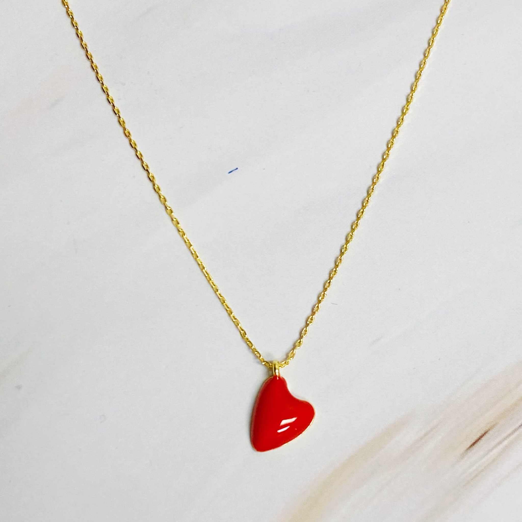 Cute colorful heart pendant necklace with red heart on gold chain, perfect for everyday layering and gifting.