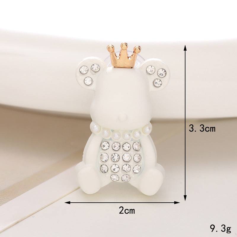 Adorable white bear ornament with crown, embellished with pearls and crystals, measuring 3.3cm height and 2cm width.