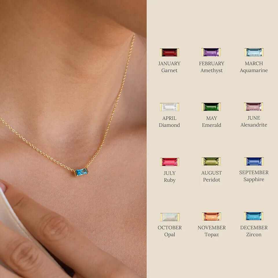 Dainty baguette birthstone charm necklace in 18K gold with monthly gemstones on display.