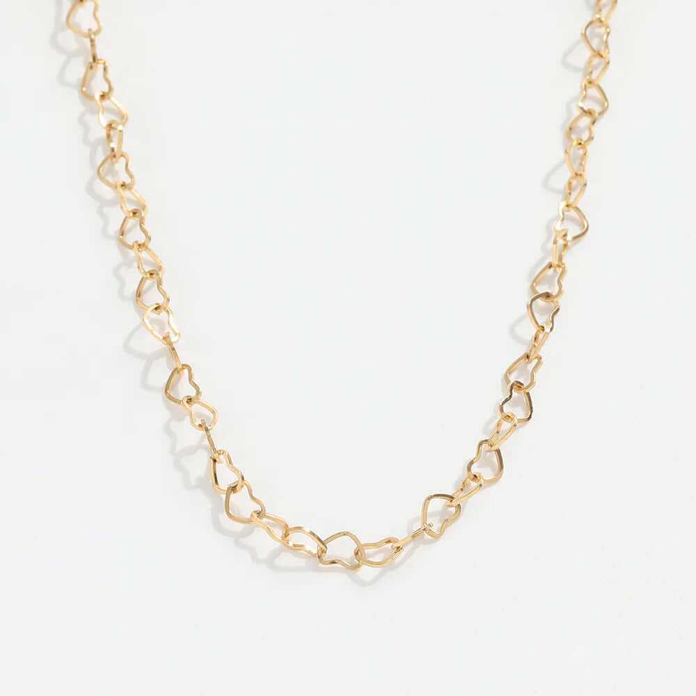 Dainty hollow heart choker necklace in gold-plated finish, featuring linked heart-shaped design.