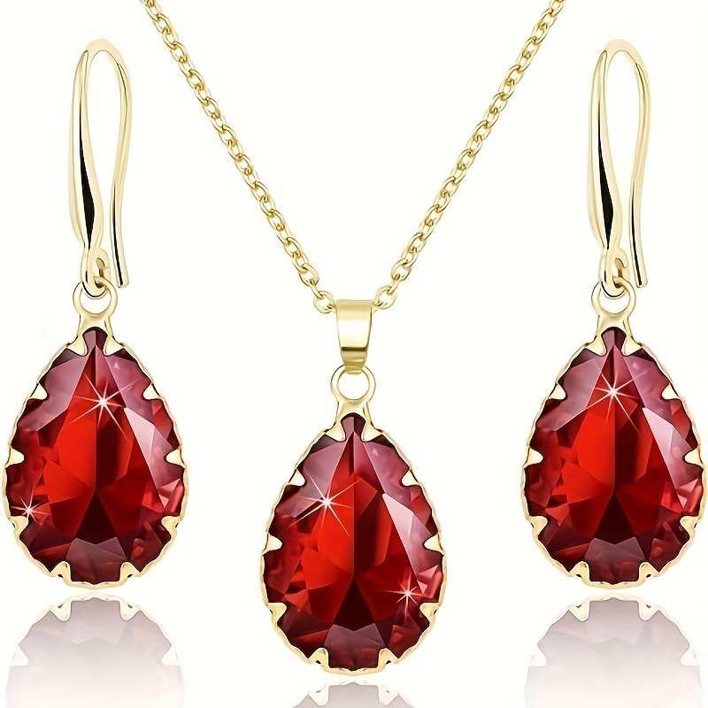 Rose gold dazzling necklace and earrings set with pear-shaped red gemstones and lobster clasp