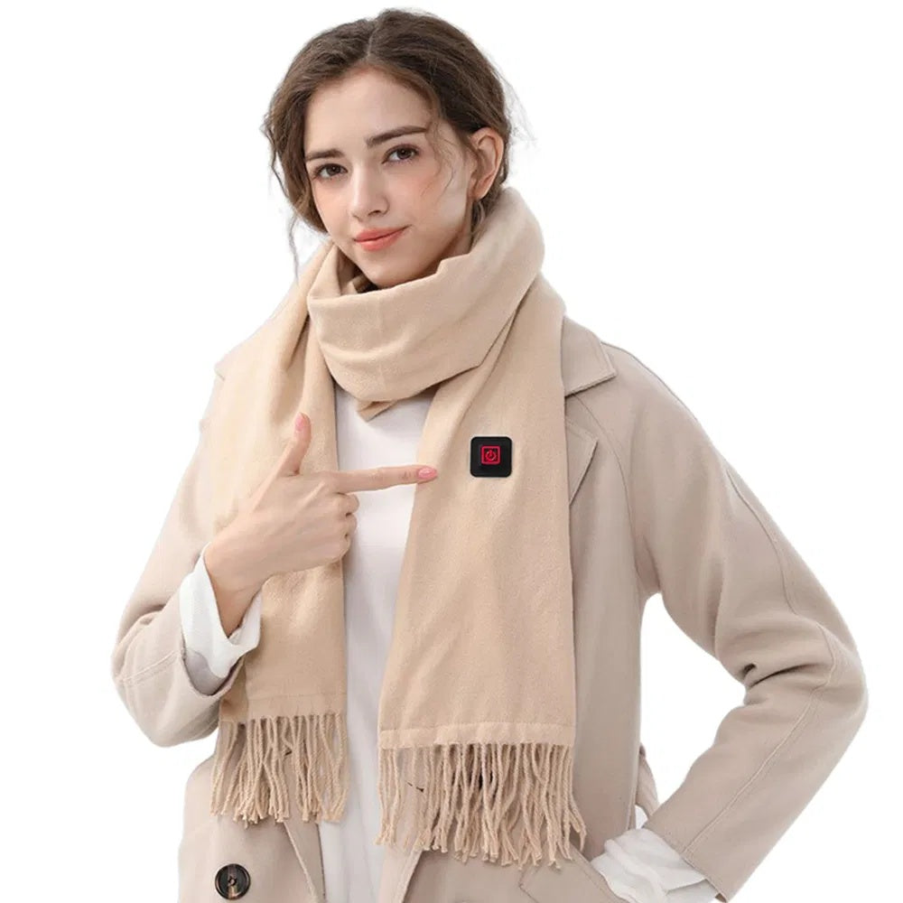 Model showcasing a beige heated winter scarf with an adjustable heating panel, perfect for keeping warm in cold weather.