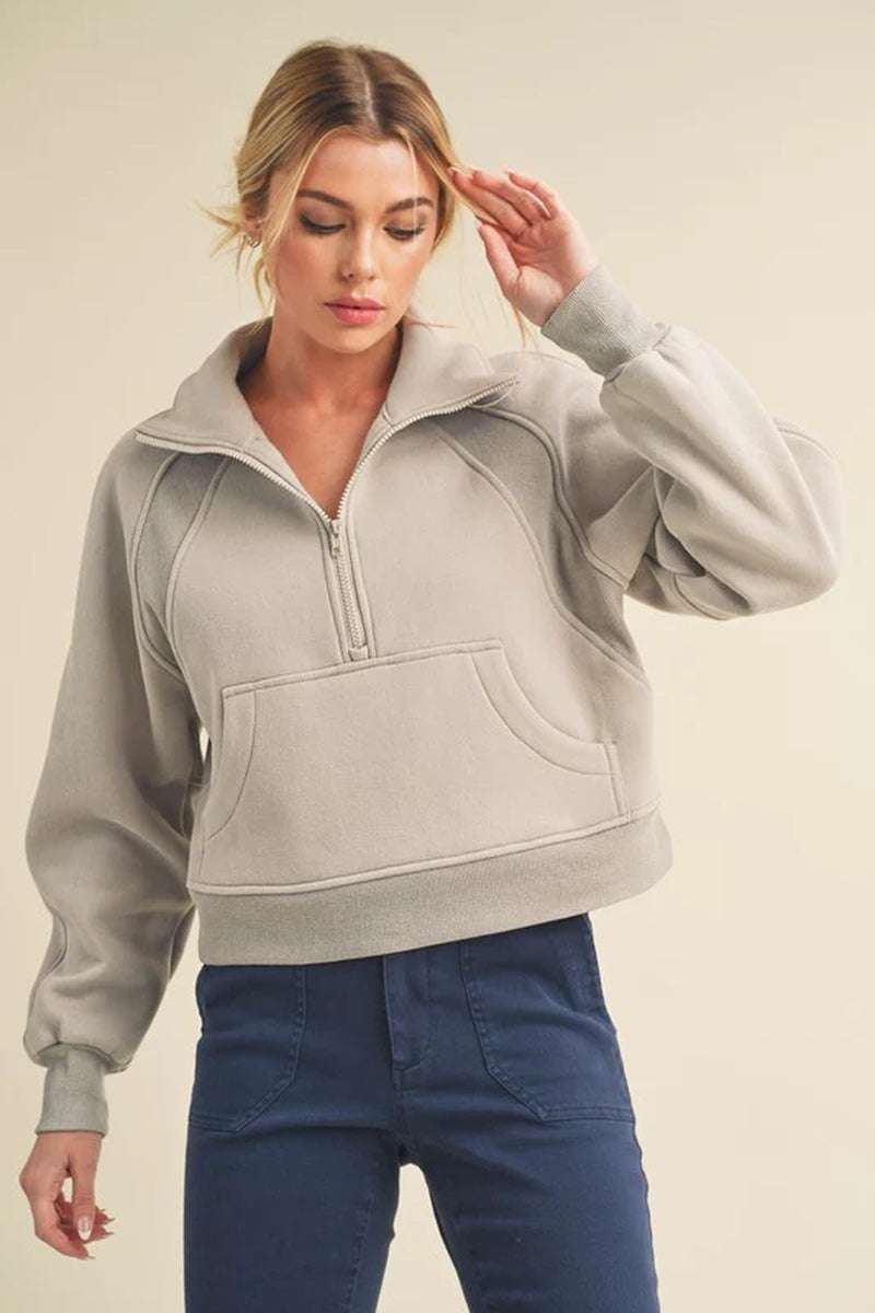 Dove half-zip sweater in grey with oversized fit, cozy funnel neck, and soft fabric for year-round comfort.