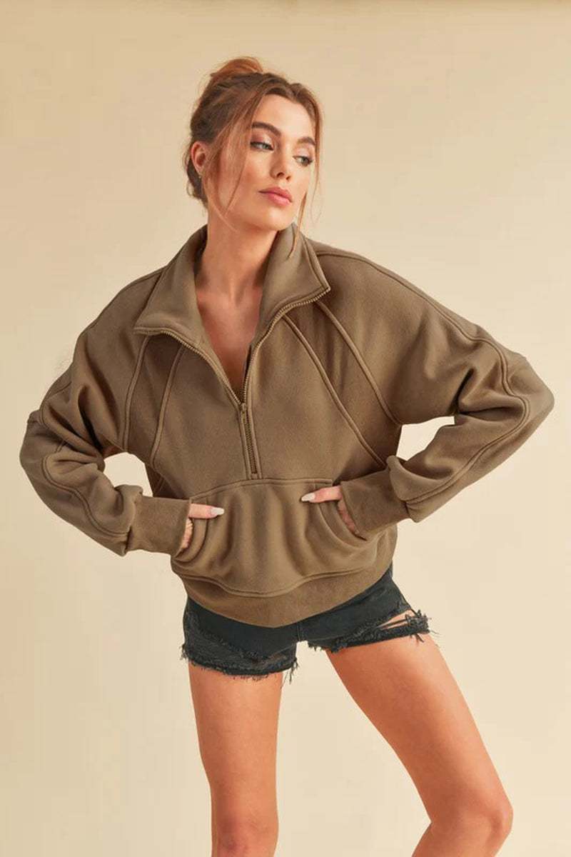 Dove funnel neck half-zip sweater in olive green, featuring an oversized fit, perfect for cozy and stylish outfits.