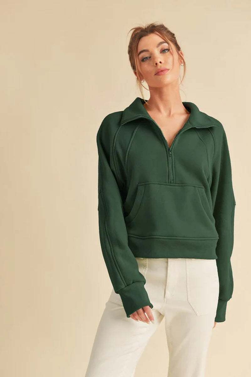 Dove Funnel Neck Half Zip sweater in green, featuring an oversized fit and cozy funnel neck, perfect for casual styling.