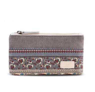 Durable canvas storage purse with multi-pocket and intricate patterned design.