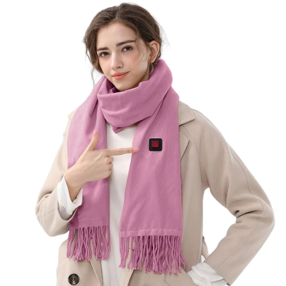 Woman wearing a pink heated winter scarf and pointing at the USB heating control, showcasing warmth and comfort.