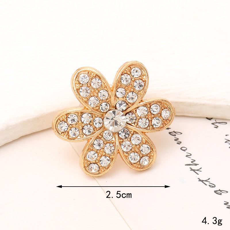 Bright Pearl Flower Shoe Ornament with gold petals and sparkling crystals, enhancing any footwear style.