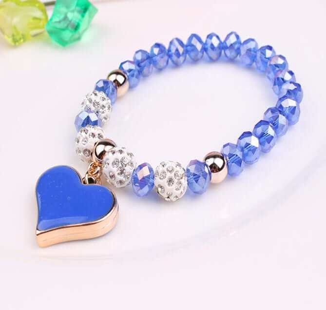 Elegant blue heart crystal bracelet with sparkling beads and metallic accents, perfect for a stylish accessory.