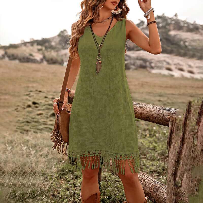 Women's solid color boho dress in green with fringe detail, perfect for summer outings and casual elegance.