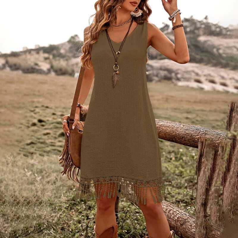 Women's solid color boho dress with V-neck and fringe detail, perfect for summer outings.