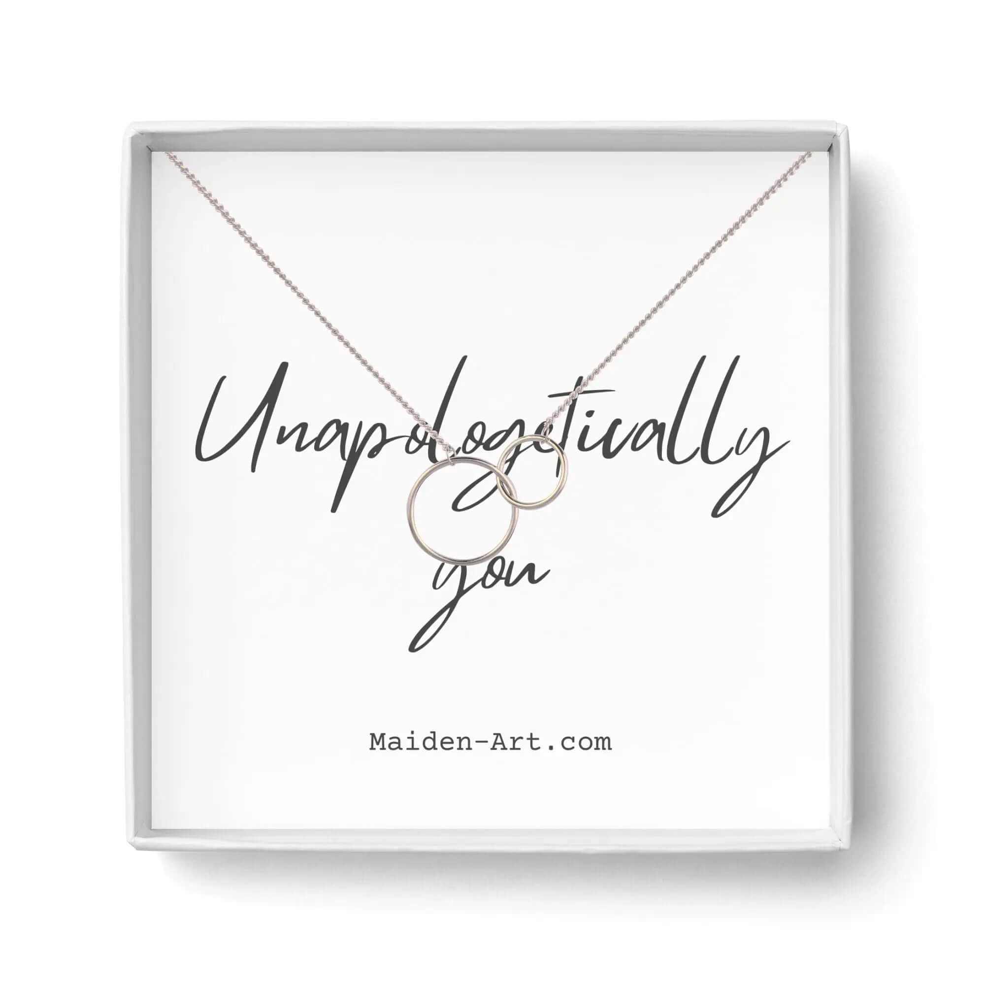 Elegant Two Circle Interlocking Pendant Necklace in gift box with 'Unapologetically you' text.