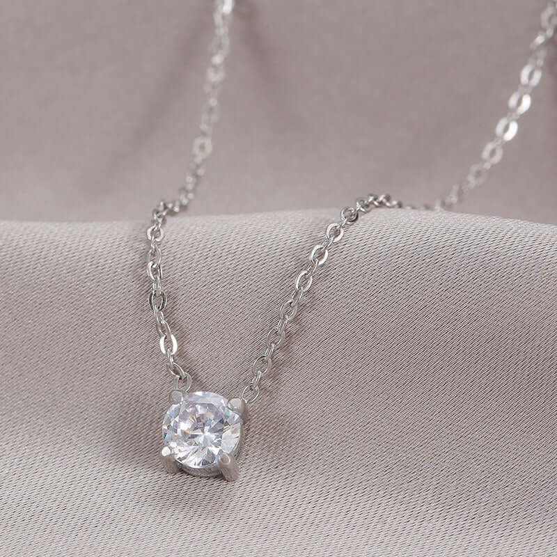 Elegant Zircon Birthstone Necklace featuring a dazzling round solitaire zircon, set on a delicate silver chain.