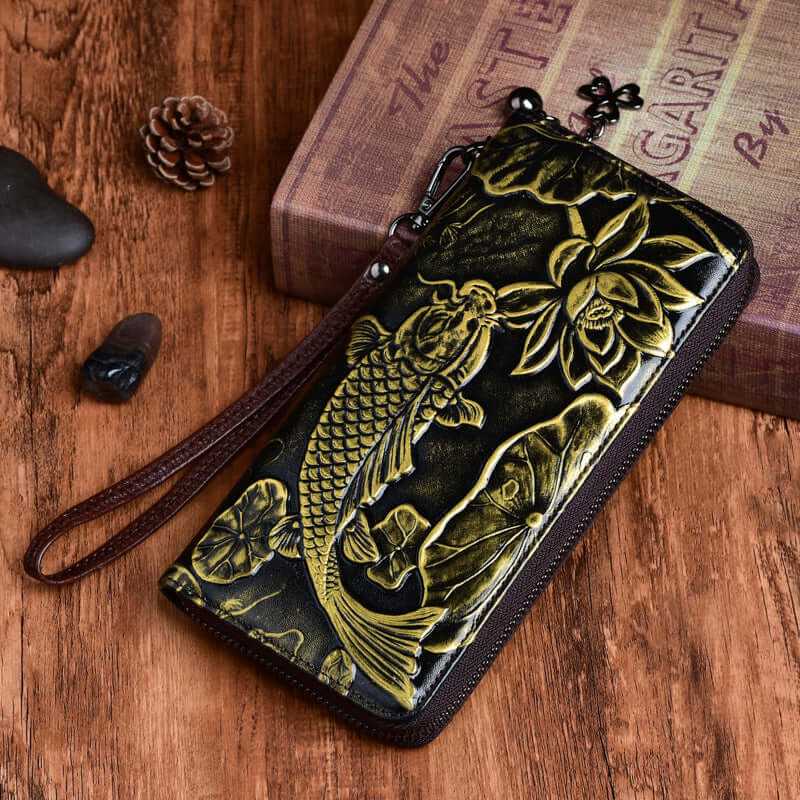 Stylish embossed wallet featuring a koi fish design on durable leather, perfect for women who appreciate elegance.