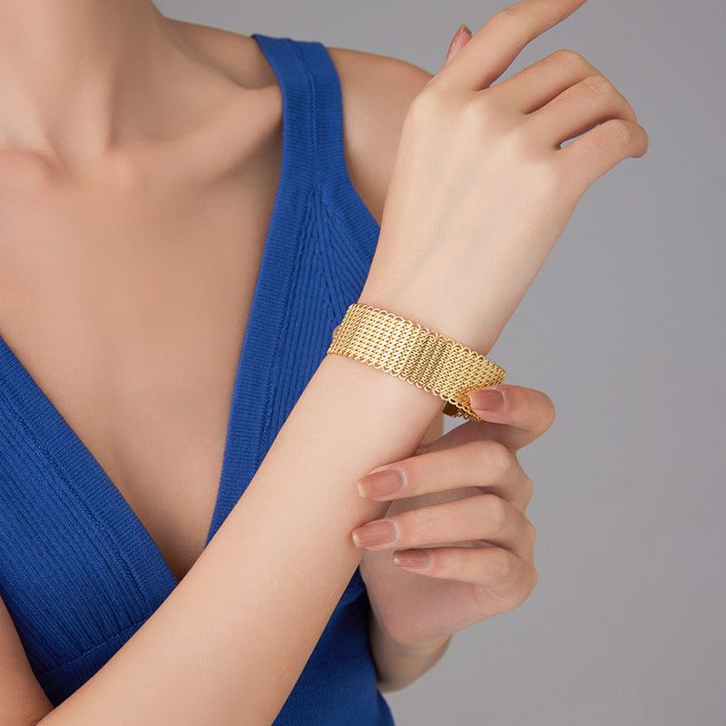 European and American style 14K gold open-ended ring bracelet on wrist