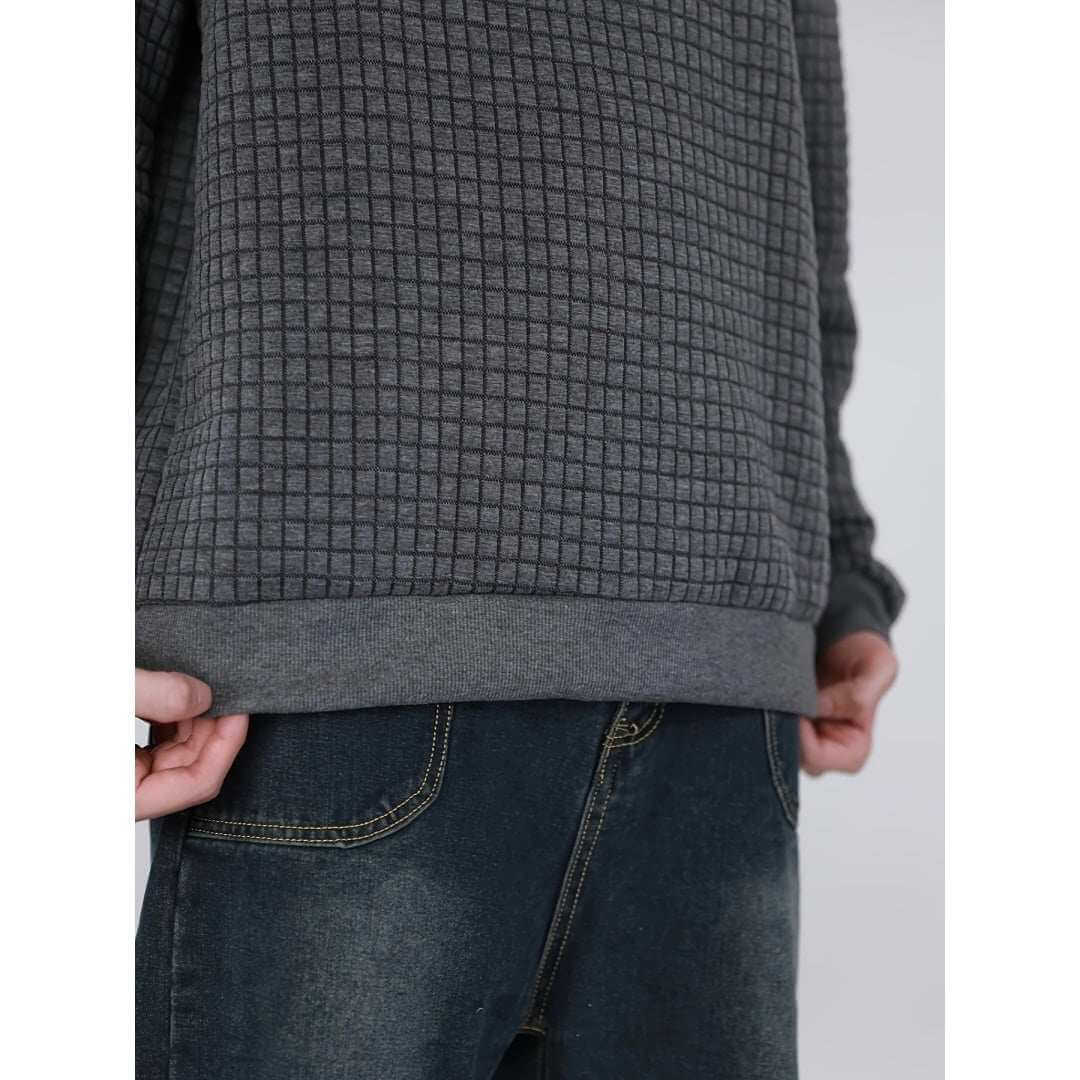 Close-up of men’s gray jacquard round neck hoodie with textured pattern and cuffed hem