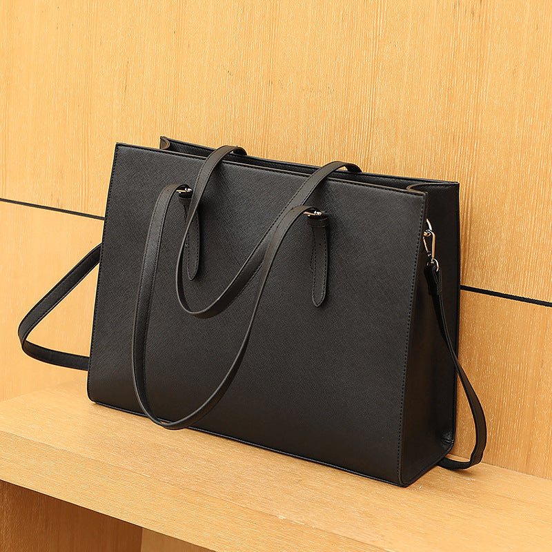 Large capacity women's shoulder portable business computer bag in black PU leather with multiple compartments and three straps