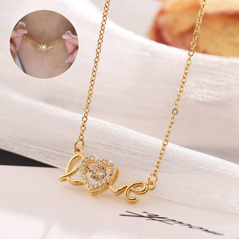Fashion clavicle chain necklace with gold-tone "Love" design and heart pendant adorned with crystals, stylish women's jewelry accessory