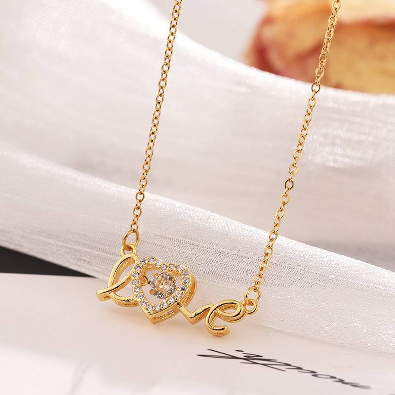 Fashion clavicle chain necklace with gold-tone love pendant and rhinestone accents