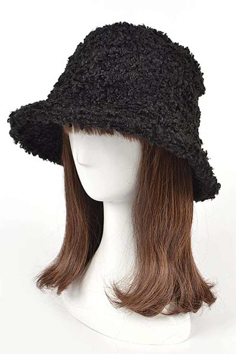 Fluffy shearling faux fur bucket hat displayed on a mannequin with brown hair, showcasing ultra-soft winter fashion.
