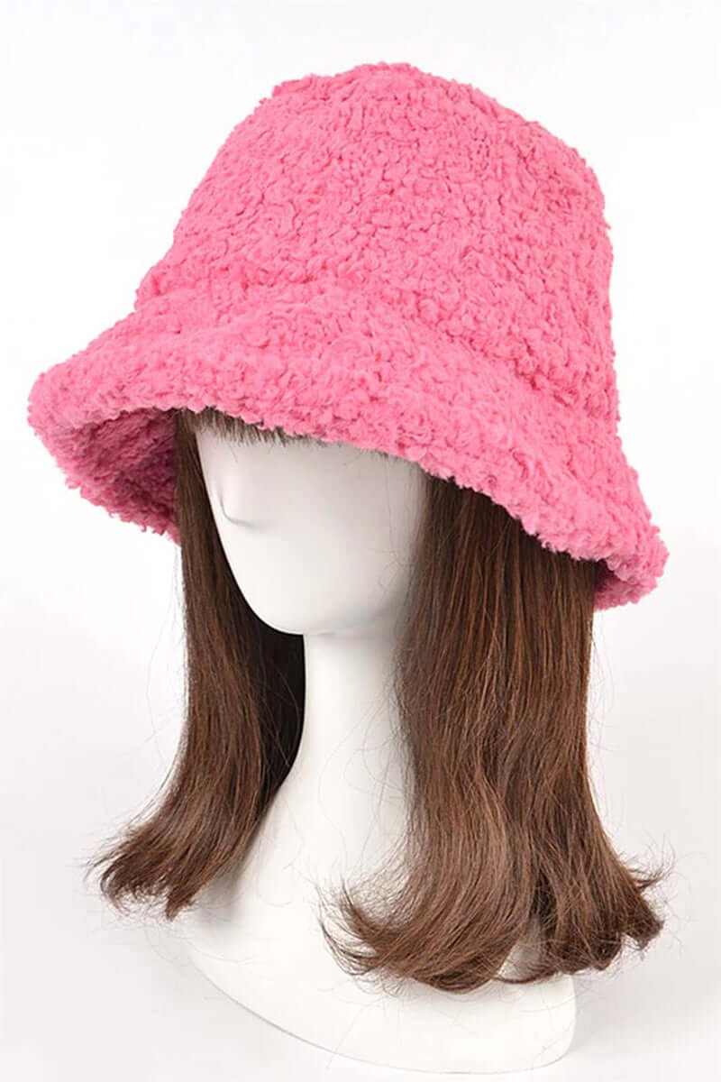 Fluffy shearling faux fur bucket hat in pink, perfect for stylish winter fashion and comfort.