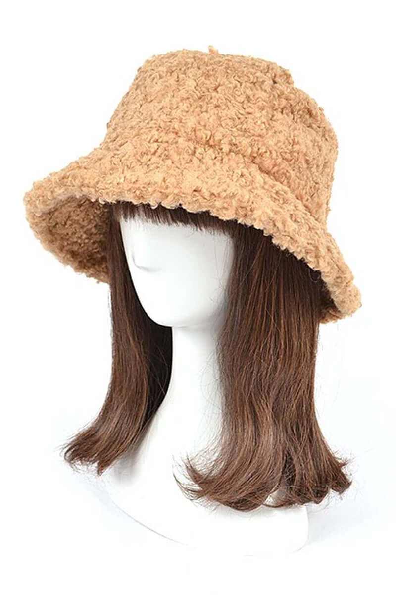 Fluffy shearling faux fur bucket hat on a mannequin, stylish winter accessory for women.