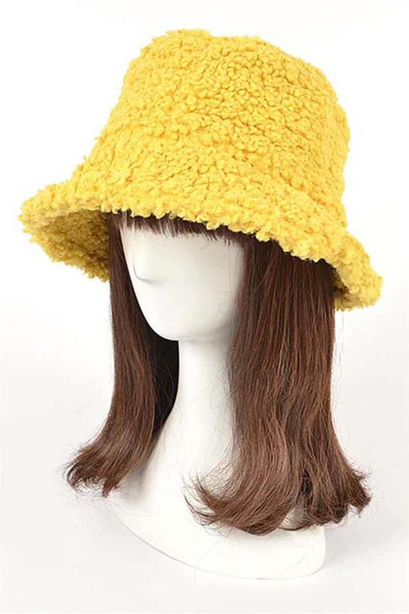 Fluffy shearling faux fur bucket hat in vibrant yellow, perfect for stylish winter outfits.