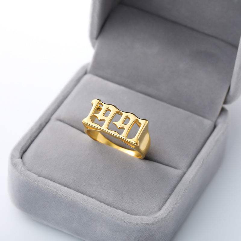 Gold stainless steel ring with futuristic vintage cyberpunk style 1991 design in grey jewelry box