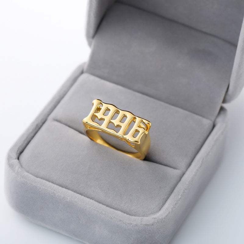 gold stainless steel futuristic vintage cyberpunk style ring with number design in gray velvet ring box