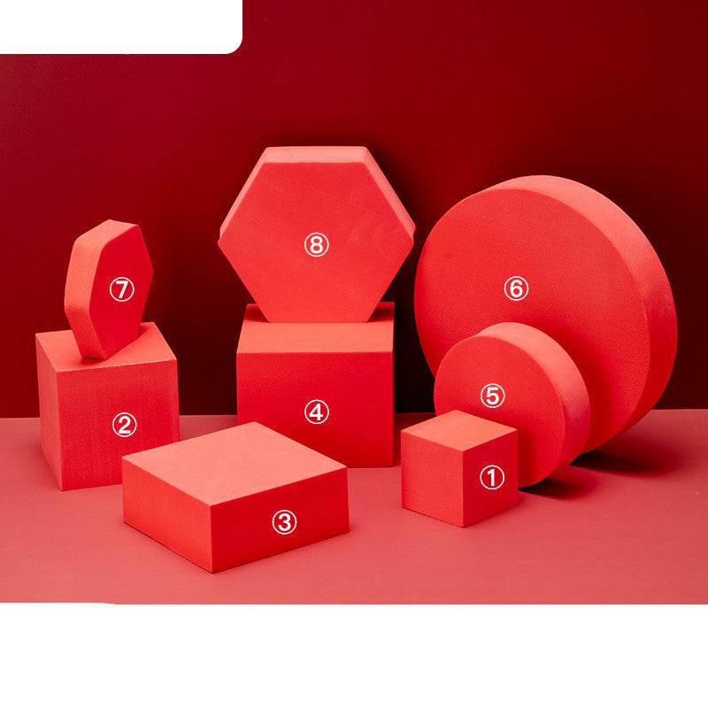 Red photo prop geometric cube and cylinder decor set on red background