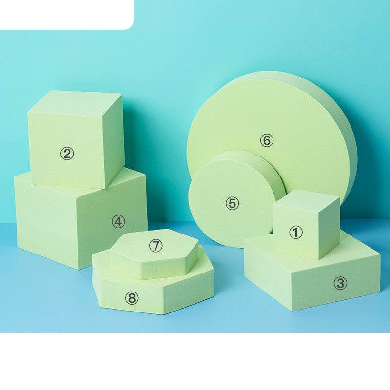 Photo prop geometric cube decor set with polymer foam cubes, cylinders, and hexagons in pastel green