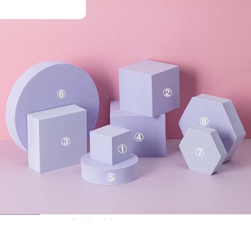 Purple photo prop geometric cube decor set with cubes, cylinders, and hexagons on pink background