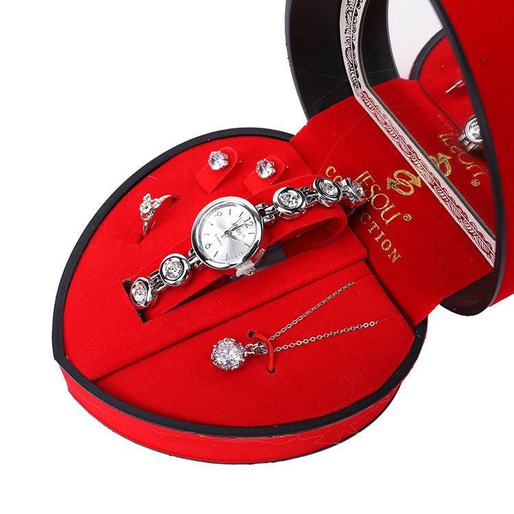 Luxury gift set with diamond-encrusted necklace, earrings, and watch in red velvet box